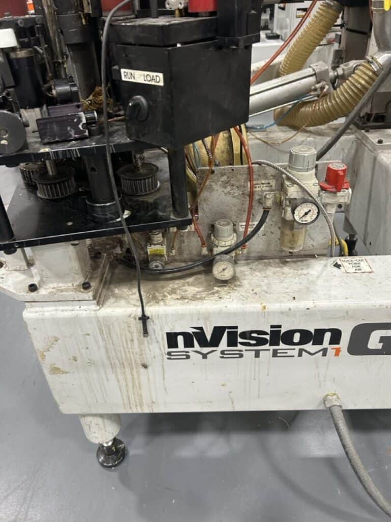 Industrial machinery, hydraulic system components, and engineering equipment in a manufacturing environment.
